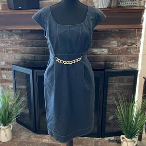 Super cute jean dress.